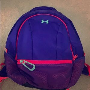 Purple Under Armour backpack with 4 pockets.